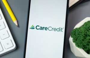 Teeth whitening Lee Plaza Dental Kansas CIty AdobeStock_972849400_Editorial_Use_Only New York, USA - 30 August 2024: CareCredit Logo on Phone Screen, Company Icon on Display.